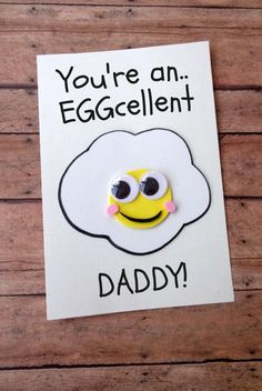 a card that says you're an eggcelent daddy with eyes and a smiley face