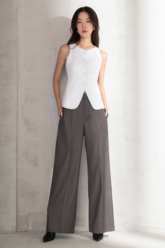 This basic trousers can be mixed with every item you want. High-waisted pants with darts and wide leg design, suitable for work, outings, and formal events. Note:*Processing time takes 7-10 working days (including 3-5 working days for manufacturing and NOT including shipping time)**Backorder Definition- The product is low in stock and in case the customer purchased successfully after out stock, the order will need time to restock.- All of the customizing products will be considered as Made To Order. Product Details - Product type: Pants- Material: Twill- Front knife pleats- Hidden zipper - Belt loop - Wide legs - Straight form - High-waisted- Front fly zipper- Length: 105cm Size & Fit - Model wears size: S- Model measurement: 83-61-90, 170cm Care Instruction The product should be dry clean Ankle Length Trousers, Linen Vest, Knife Pleats, Mean Blvd, Wide Trousers, Sand Castle, Leg Design, Wide Legs, V Cuts