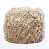 a large fluffy, furry poufce sits on the floor in front of a white background