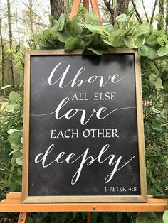 a chalkboard sign that says, we are all else love each other deeply