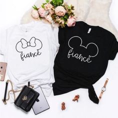 This Mickey And Minnie Fianc Shirt Set Are A Great Gift Whether As An Engagement, Shower, Or Bachelorette Party. This Set Comes With Two T-Shirts: Mickey Black And Minnie White Shirts Both Size Large. Disney Engaged Shirts, Disney Engagement Shirts, Engaged Shirts, Mickey And Minnie, White Shirts, Bachelorette Party, Great Gifts, Cricut, Womens Tops