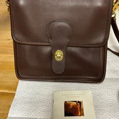 Vintage Coach Deep Brown Leather Station Bag. New, Price Tag Still On It. Pristine Condition. In Original Coach Box. Very Smart Looking! Condition: New Make / Manufacturer: Coach Model Name / Number: L6b-5130 Size / Dimensions: 9w 9.25h 5d Coach Leather Bags As A Gift, Coach Brown Bag As A Gift, Coach Brown Bag As Gift, Coach Brown Bag For Gift, Coach Satchel Shoulder Bag Gift, Classic Shoulder Bag With Magnetic Closure For Gift, Classic Shoulder Bag With Magnetic Closure As Gift, Coach Formal Bags With Magnetic Closure, Coach Bags With Magnetic Closure For Formal Occasions