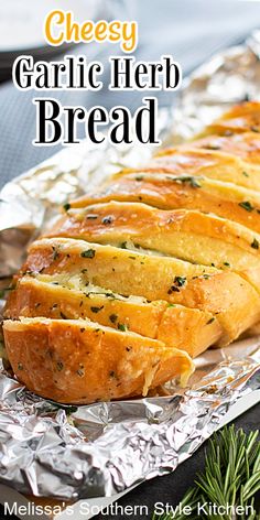 garlic herb bread on aluminum foil with rosemary sprigs in the foreground and text overlay