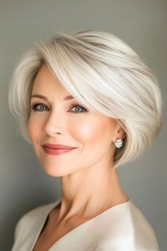 Save this pin for the best short layered haircuts with bangs. This classic blonde bob gets a fresh update with choppy layers and long, side-swept bangs. The deep side part creates a flattering asymmetry. Short Bob With Long Bangs, Dakota Johnson Haircut, Short Layered Haircuts With Bangs, Braids Maintenance, Gray Bob Hairstyles, Textured Bob Hairstyles, Short Haircuts Ideas, Layered Haircuts With Bangs, Short Silver Hair