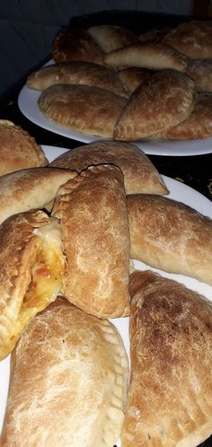 several pastries sitting on top of white plates