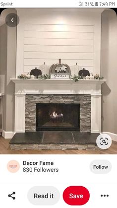 the fireplace is decorated with white pumpkins and greenery on it's mantle