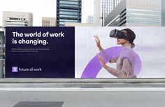 an advertisement on the side of a building with a woman wearing a virtual headset