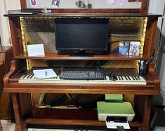 a computer desk with a keyboard and monitor on it