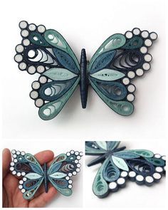 the butterfly is made out of paper and has white dots on it