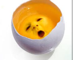 an egg with a face painted on it's side sitting in front of a white background