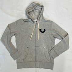 Oatmeal/Heathered Grey Color Drawstring Hood Zip Front Kangaroo Pocket With Silver Rivets Flocked Navy Horseshoe Logo On Chest Flocked Navy Buddha World Tour Graphic On Back By True Religion 100% Cotton Measurements Chest 24”/Length 28” Christmas Lists, Horseshoe Logo, Cute Jackets, Dream Clothes, Grey Color, Grey Hoodie, World Tour, Rivets, True Religion