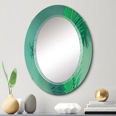 a round mirror sitting on top of a table