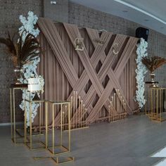 the stage is decorated with gold and white flowers