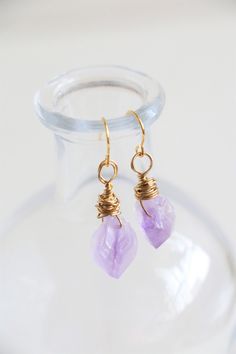 Handmade dainty raw amethyst earrings in 18k gold plated.  This listing is for a pair of earrings. Gemstone size: about 13-15mm Earrings size: total about 30mm length Metal Component: Brass made 18k gold plated ﹎﹎﹎﹎﹎﹎﹎﹎﹎﹎﹎﹎﹎﹎﹎﹎﹎﹎﹎﹎﹎﹎ ▲ Care instruction:  Please remove it before bathing or swimming.  Avoid your jewelry touching chemical such as hairsprays or perfumes.  Using soft cloth to clean your jewelry every time after wearing it, and store it in a dry and cool place. ▲ Gift packaging:  All Handmade Amethyst Crystal Earrings In Gold, Gold Amethyst Drop Earrings, Amethyst Wire Wrapped Crystal Earrings As Gift, Gold Amethyst Crystal Earrings With Gemstone, Gold Amethyst Gemstone Crystal Earrings, Gold Amethyst Crystal Earrings, Gold Amethyst Earrings With Ear Wire, Gold Amethyst Dainty Earrings, Dainty Gold Amethyst Earrings