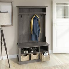 an entryway with a coat rack and baskets