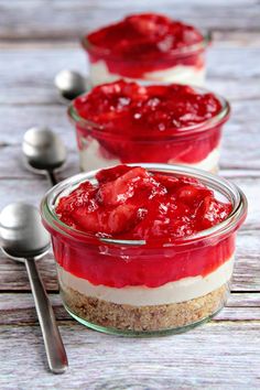 three desserts in small glass dishes with spoons