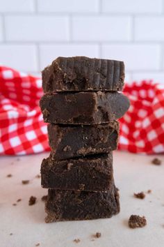 four pieces of brownie stacked on top of each other