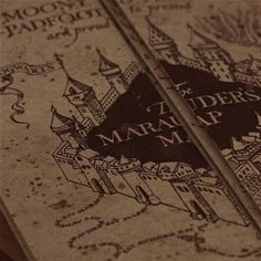 an old book is opened to show the map and title for mara's map