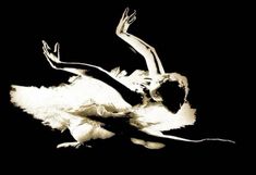 a black and white photo of a ballerina