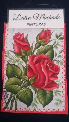 a red rose on a white doily with the words davia machhado pinturas