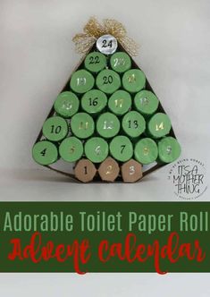 a toilet paper roll christmas tree with numbers on it and the words adorable toilet paper roll calendar