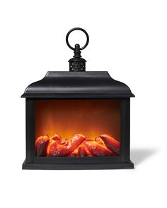 an electric fireplace heater with flames on the front and back sides, in black