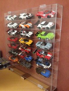 a display case filled with lots of toy cars