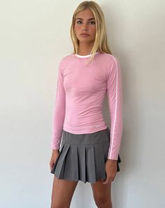 In a pink soft stretch lycra, the Bonija top features a bodycon design with long sleeves and a crew neckline with rib detailing at the collar. Pink Long Sleeve Top Outfit, M Embroidery, Bodycon Design, Pink Long Sleeve Top, Chiffon Romper, Skirt Model, Flamingo Pink, Bandeau Dress, Lace Crop Tops