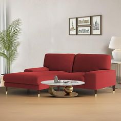 a living room with a red couch and coffee table