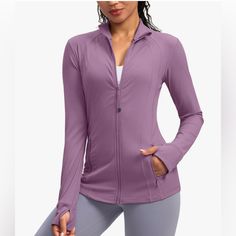 Beautiful Mauve Pink Color 75% Polyamide 25% Elastine Offering Stretchy Comfort Coordinating Zipper Color 2 Front Pockets Thumb Slots On Sleeves Versatile Long Sleeve Track Jacket For Fall, Purple Stretch Outerwear For Fall, Stretch Long Sleeve Track Jacket With Pockets, Functional Purple Long Sleeve Outerwear, Purple Long Sleeve Activewear For Spring, Functional Long Sleeve Purple Outerwear, Purple Long Sleeve Functional Outerwear, Purple Long Sleeve Stretch Outerwear, Versatile Solid Color Long Sleeve Track Jacket