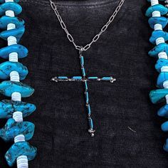 Turquoise Zuni cross pendant by Native American artist Cletus Lamy. Authentic Kingman turquoise and sterling silver. Why We ❤ It: This Native American made cross pendant features the traditional Zuni petit point that is always lovely and collectible. Artist: Cletus Lamy Tribe: Zuni Metal: Sterling Silver Stone: Kingman Turquoise Length: 2 3/8" including bail Bail: 2mm Weight: 1g **chain/Navajo pearls not included** Bohemian Blue Cross Jewelry, Bohemian Turquoise Cross Jewelry, Handmade Southwestern Cross Necklace, Southwestern Handmade Cross Necklace, Bohemian Blue Cross Pendant Necklace, Blue Bohemian Necklace With Cross Pendant, Spiritual Cross Turquoise Necklace For Gift, Spiritual Turquoise Cross Necklace As Gift, Spiritual Turquoise Cross Necklace