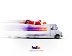 the fed ex truck is driving down the road with santa clause on it's back