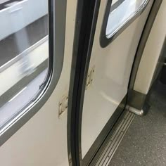 an empty train car with the door open