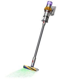 a close up of a vacuum cleaner on a white background with green and yellow dust