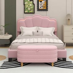 a pink bed sitting on top of a white rug