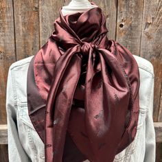 Our elegant wild rag/scarf in brown with small feather pattern. A perfect square - measuring 42"x42". Adding that extra touch of a western style to your outfit. 100% soft silk feeling polyester is durable to keep you warm in the cold and fashionable for any occasion. Plus it's machine washable!  Additional accessories are available- (Please see our slide options on our site)  Leather slides Western concho slides Crystal concho slide  Buckle slides Wither Strap, Beaded Dog Collar, Bridle Bag, Designer Dog Collars, Spur Straps, Western Buckles, Perfect Squares, Wild Rag, Feather Pattern