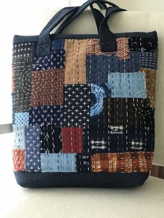 a handbag made out of patchwork fabric