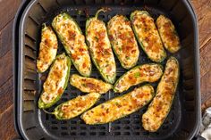 an air fryer with zucchini and cheese in it