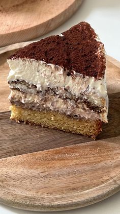 a piece of cake sitting on top of a wooden cutting board