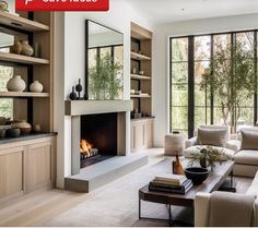 a living room filled with furniture and a fire place in the middle of it's walls