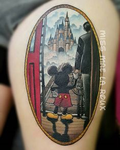 a person with a mickey mouse tattoo on their thigh