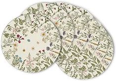 four plates with floral designs on them