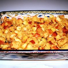 a casserole dish filled with potatoes and meat