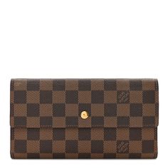 This is an authentic LOUIS VUITTON Damier Ebene Porte Tresor International Wallet. This wallet is crafted of durable Damier coated canvas in ebene brown. The wallet features a front flap that opens to a cross-grain leather interior with card slots, patch pockets, and a snap compartment. Louis Vuitton Wallet, Louis Vuitton Damier Ebene, Damier Ebene, Leather Interior, Authentic Louis Vuitton, Louis Vuitton Damier, Patch Pocket, Card Slots, Slots