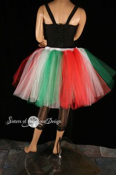 a female mannequin wearing a multicolored tutu skirt and black top