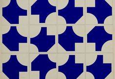 blue and white tiles with an arrow in the middle are arranged on top of each other