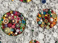 two circular objects made out of different types of buttons