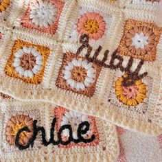 two crocheted squares with the words baby and child written in black on them