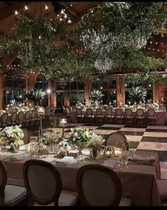 a banquet hall set up with tables and chairs