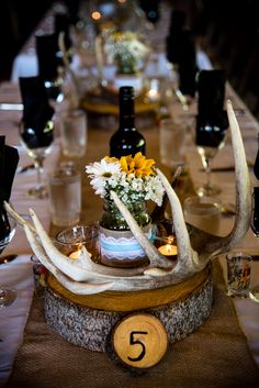 the table is decorated with antlers and flowers